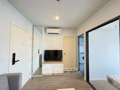 Modern living room with sleek design and integrated appliances