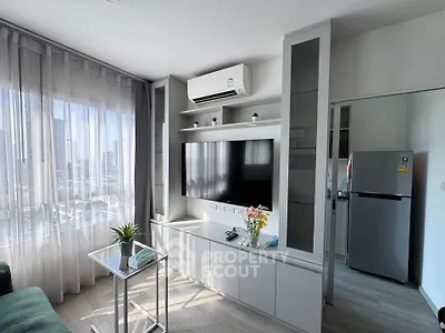 Modern living room with sleek TV unit and air conditioning, featuring large windows and stylish decor.
