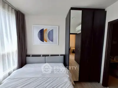 Modern bedroom with stylish decor and ample natural light
