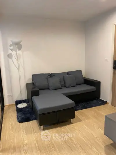 Cozy living room with modern sofa and stylish floor lamp