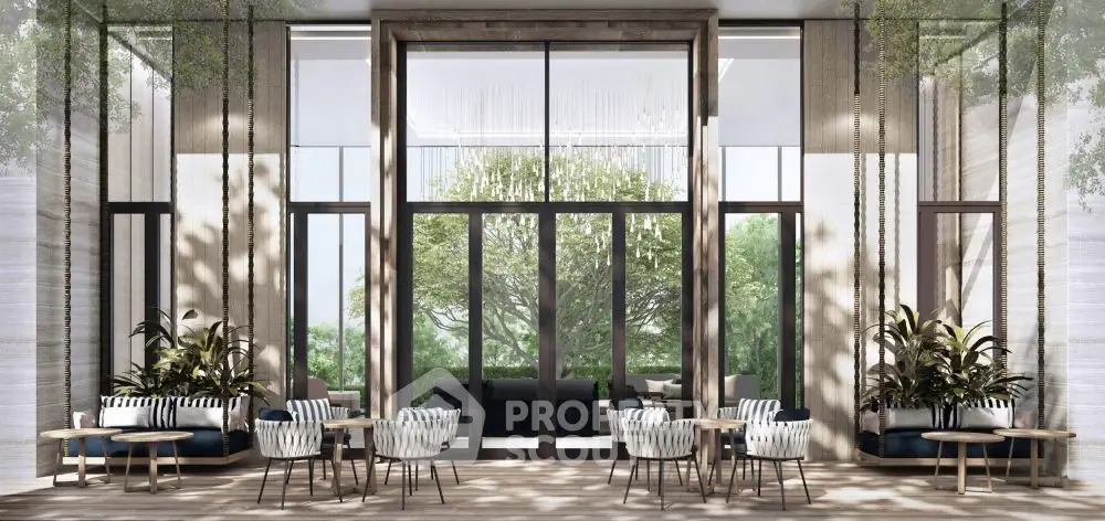 Luxurious modern lobby with elegant seating and large windows overlooking lush greenery.