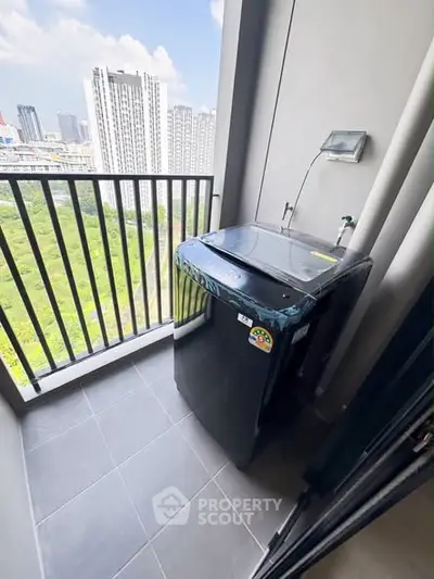 Modern balcony with washing machine and city view, perfect for urban living convenience.