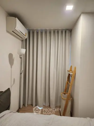 Cozy bedroom corner with air conditioning and modern decor