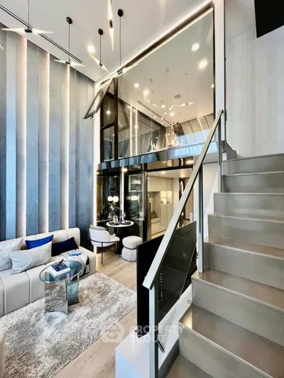Luxurious multi-level living space with modern staircase, high ceiling, and elegant interior design, perfect for upscale urban living.