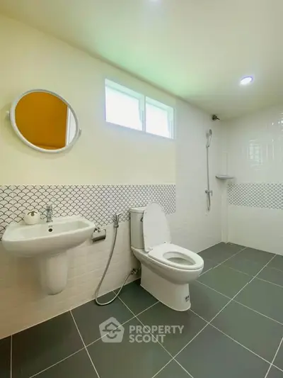 Spacious modern bathroom with sleek fixtures and stylish tile design