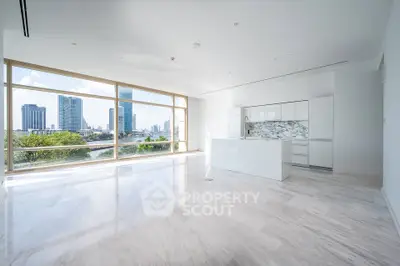 Luxurious open-plan living room with stunning city views and modern kitchen design.