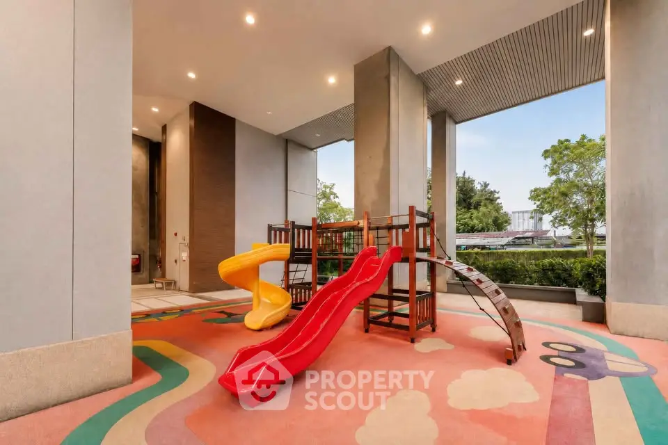 Modern apartment building with colorful children's playground area, perfect for families.