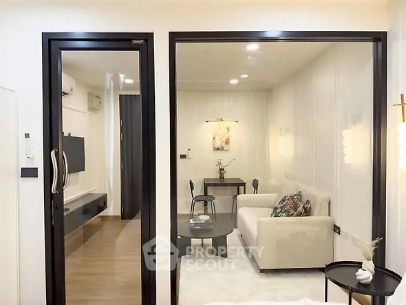 Modern living room with glass partition and stylish decor
