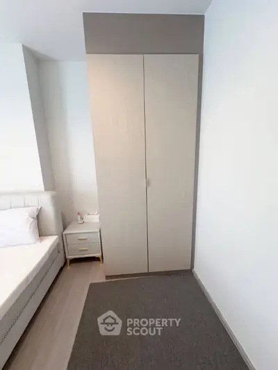 Modern bedroom with sleek wardrobe and minimalist design