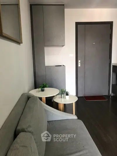 Modern living room with sleek gray furniture and stylish decor