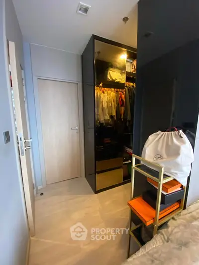 Modern bedroom with sleek walk-in closet and stylish decor