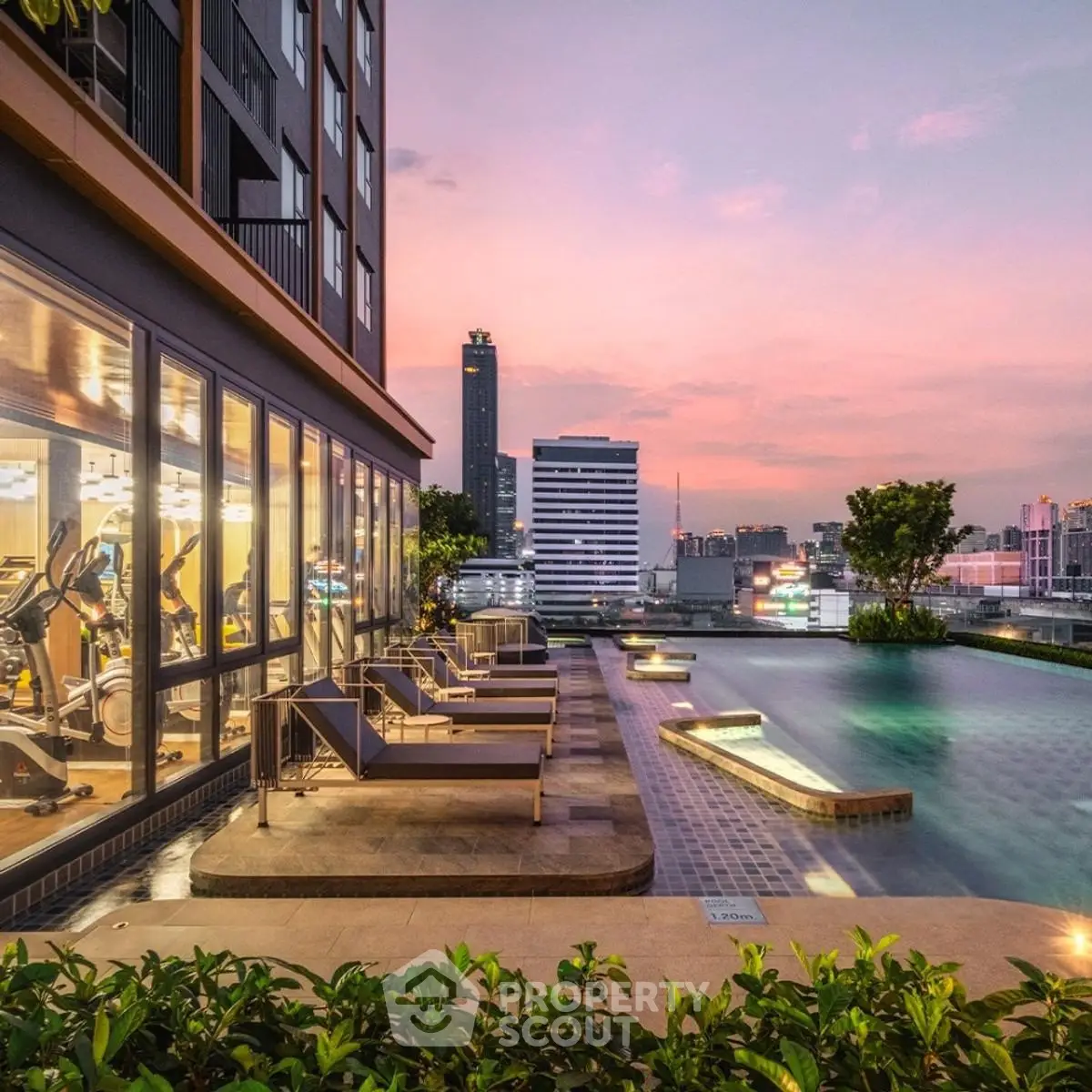 Luxurious rooftop pool with stunning city skyline view at sunset