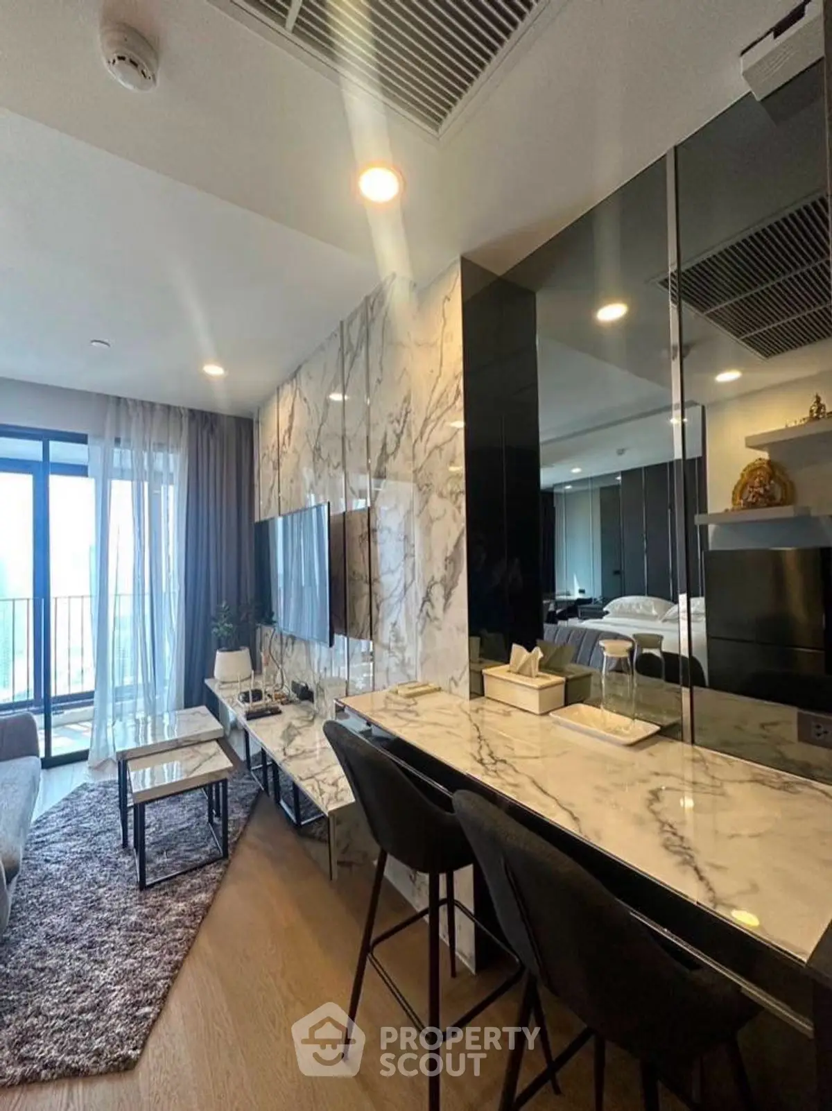 Luxurious modern living room with marble accents and open layout