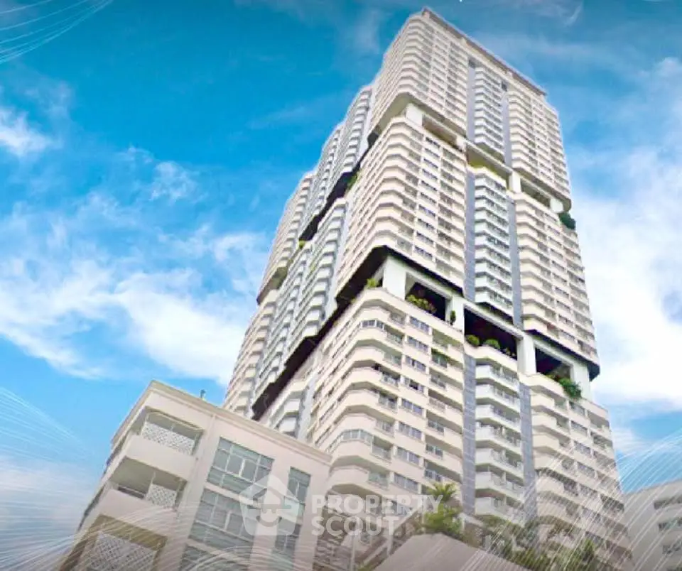 Stunning high-rise building with modern architecture against a clear blue sky.