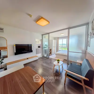 Modern open-plan living room with stylish decor and natural light