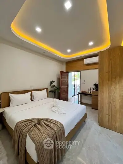 Modern bedroom with stylish ceiling lights and cozy decor