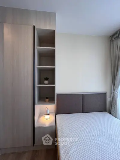 Modern bedroom with built-in wardrobe and cozy lighting