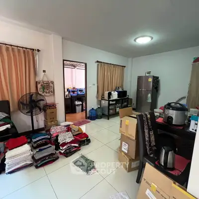 Spacious living area with modern appliances and ample storage space, perfect for comfortable living.