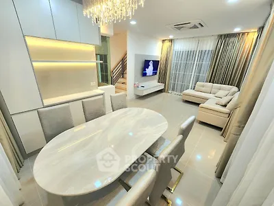 Luxurious modern living room with elegant dining area and stylish lighting