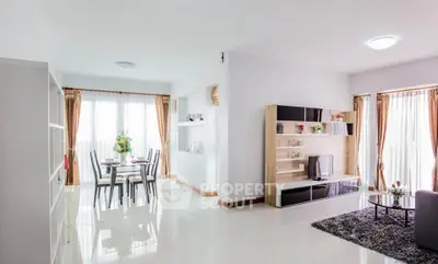 Spacious modern living room with dining area and natural light