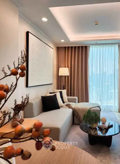 Elegant living room with modern decor and large window offering city view