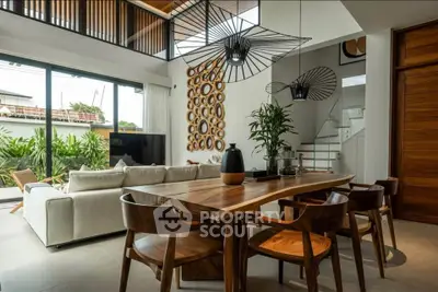 Luxurious open-plan living room with modern decor and garden view