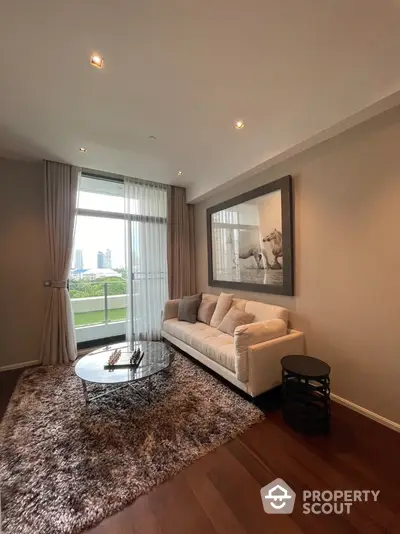 Elegant living room with plush sofa and city view from large window