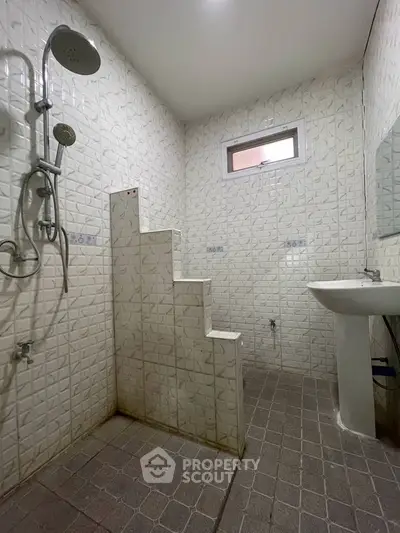 Modern bathroom with unique step design and stylish fixtures