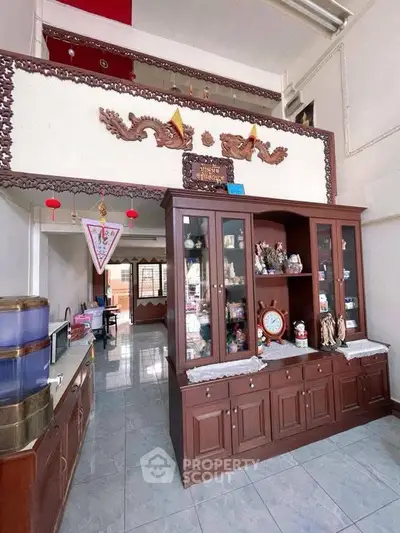 Charming living room with traditional wooden decor and spacious layout, perfect for cozy family gatherings.