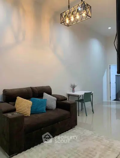 Modern living room with stylish lighting and cozy seating area