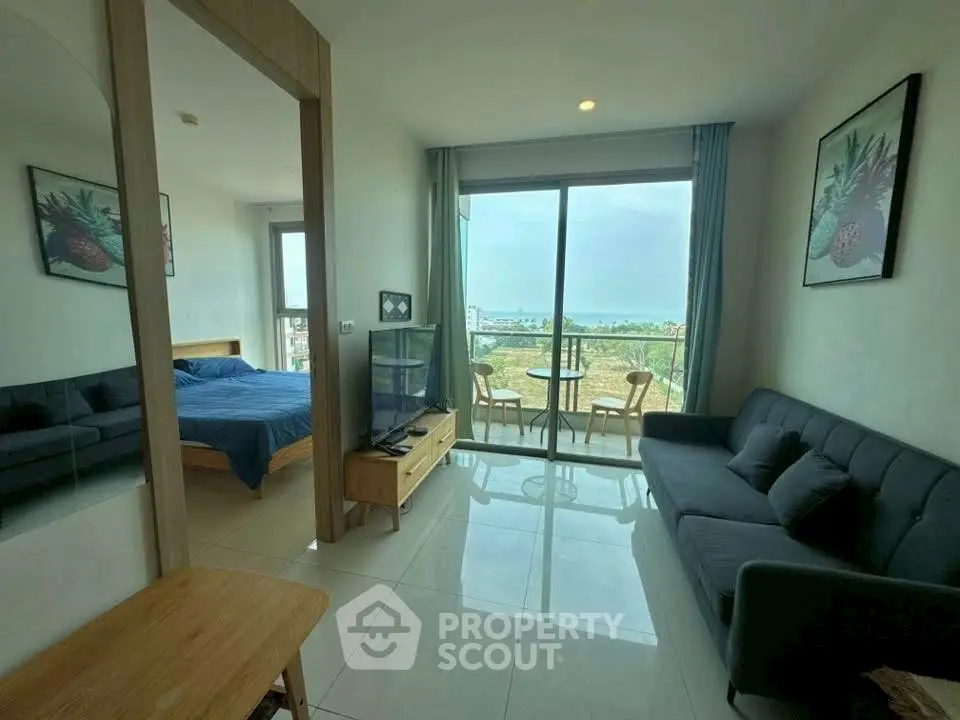 Modern living room with balcony and scenic view in stylish apartment