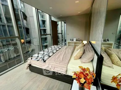 Luxurious modern bedroom with floor-to-ceiling windows and stylish decor