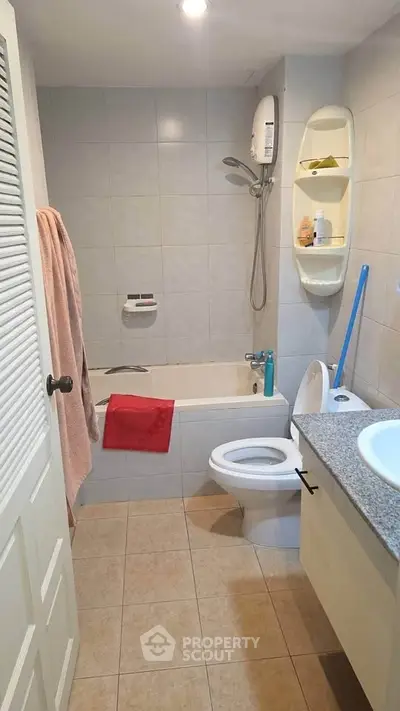Cozy bathroom with bathtub and modern fixtures in a stylish apartment.