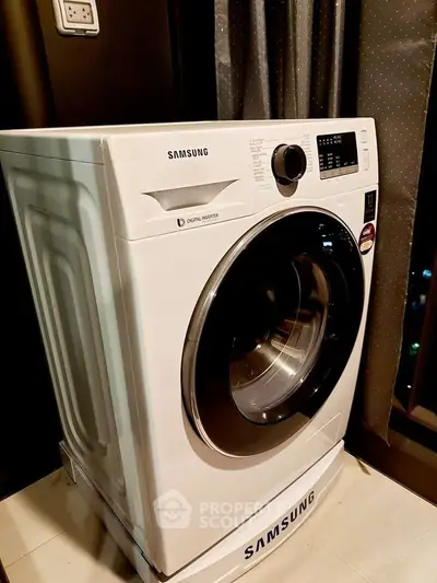 Modern Samsung washing machine in stylish laundry area with elegant curtains.