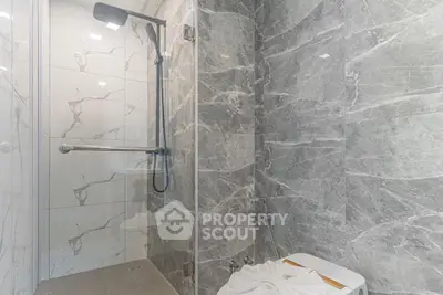 Luxurious marble bathroom with modern shower and sleek design