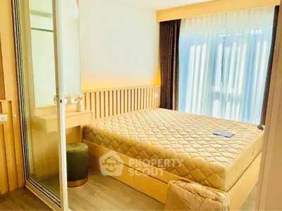 Modern bedroom with large window and stylish decor