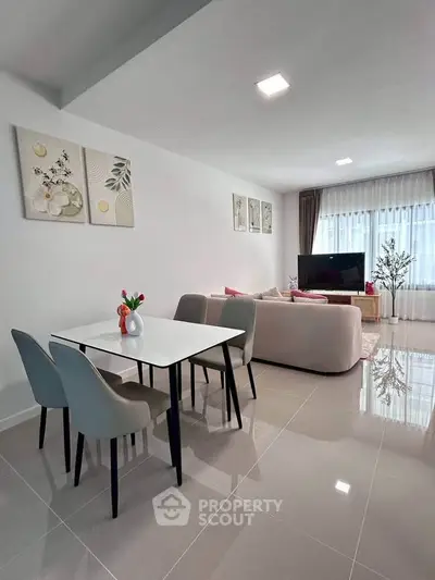 Modern living room with sleek dining area and stylish decor