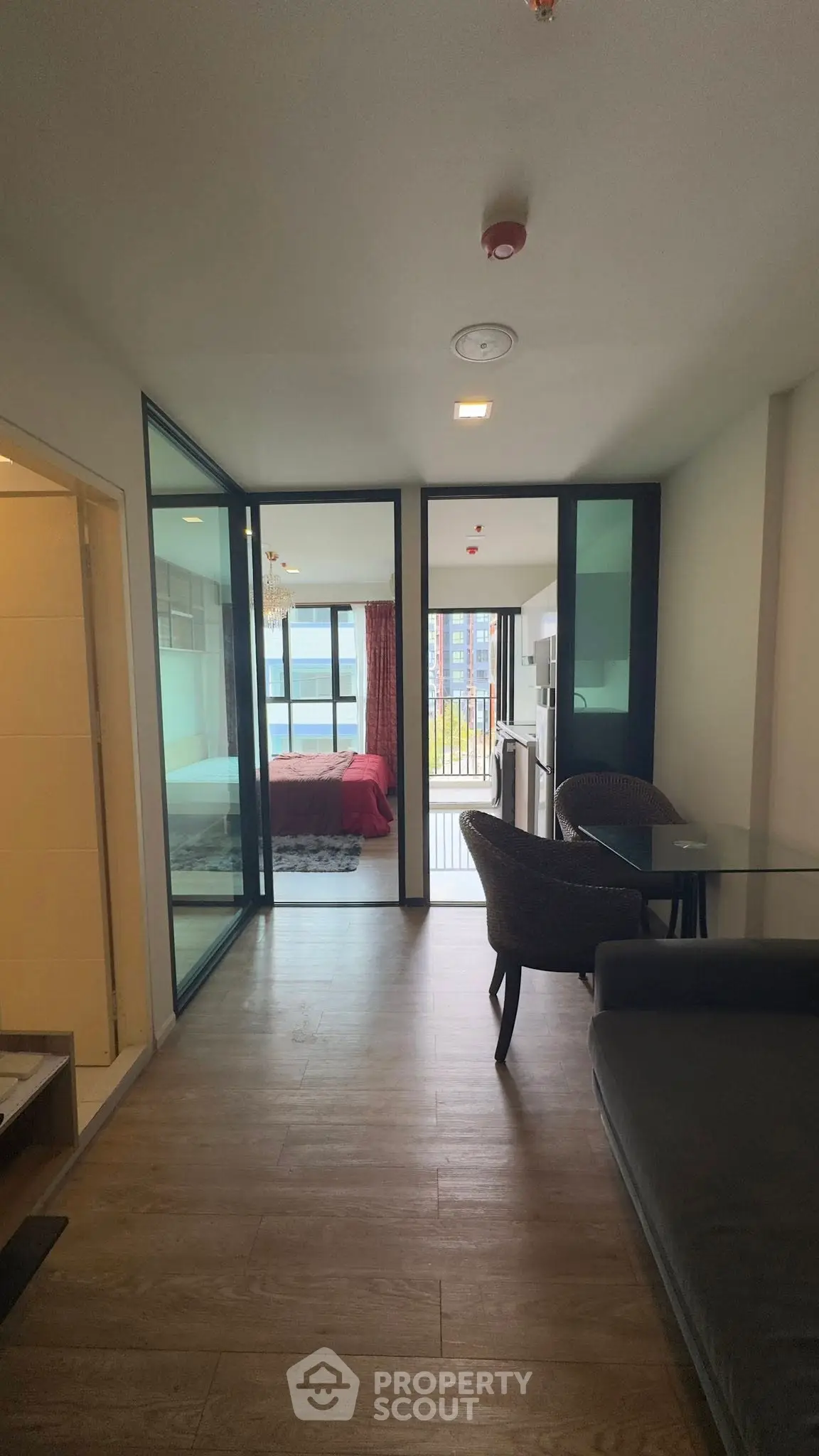 Modern apartment interior with open layout and balcony view