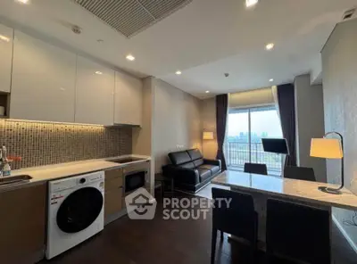 Modern open-layout kitchen and living room with city view balcony