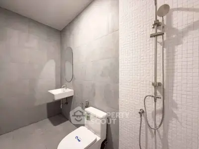 Modern minimalist bathroom with sleek fixtures and spacious shower area.