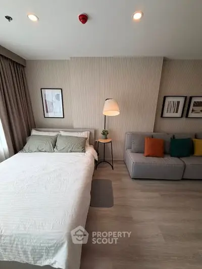 Modern bedroom with cozy bed and stylish decor in a bright apartment