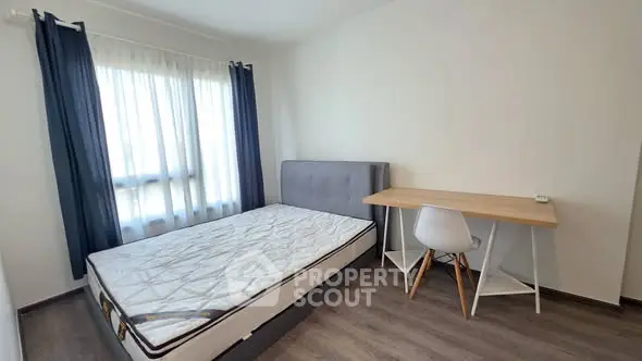 Modern bedroom with minimalist design and ample natural light