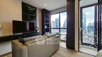 Modern living room with city view and sleek furniture in high-rise apartment.