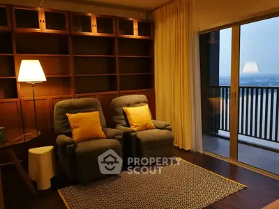 Cozy living room with plush armchairs and balcony view