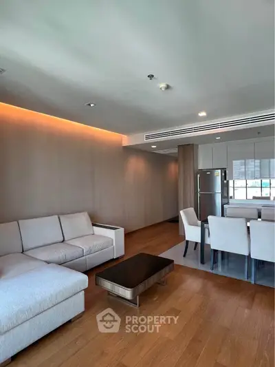 Spacious modern living room with open layout and elegant dining area