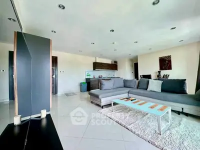 Spacious modern living room with open kitchen and stylish decor