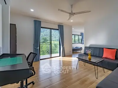 Spacious living room with mountain view and modern furnishings