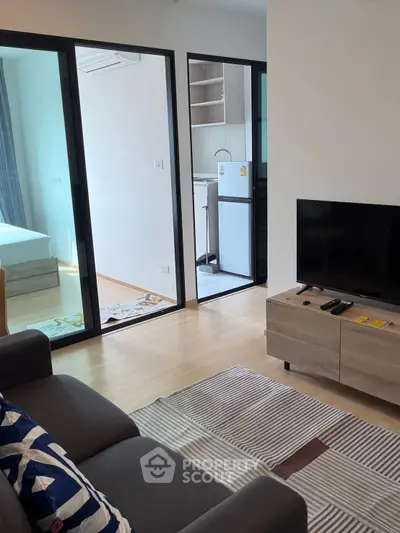 Modern apartment interior with cozy living room and open kitchen layout