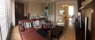 Spacious living room with modern furniture and natural light, ideal for family gatherings.