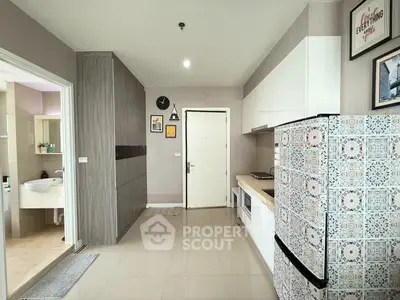 Modern kitchen with stylish fridge and ample storage in a contemporary apartment